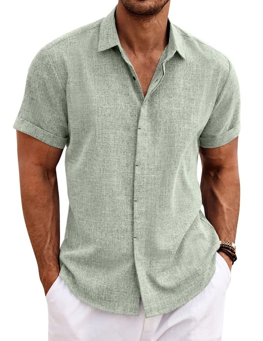 Sage green short-sleeve linen shirt with white trousers